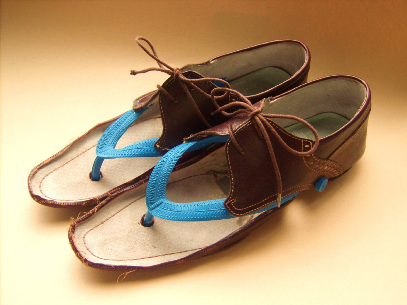 Jasleen Kaur, Father's Shoes, 2010. Repurposed leather brogues and flip flop