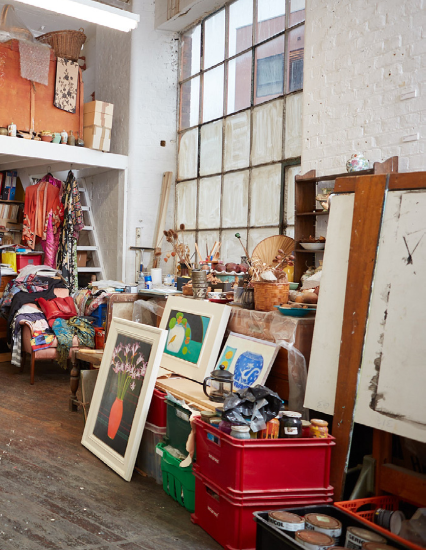 Artists Studio Interior, pictures and materials stacked and leaning against wall